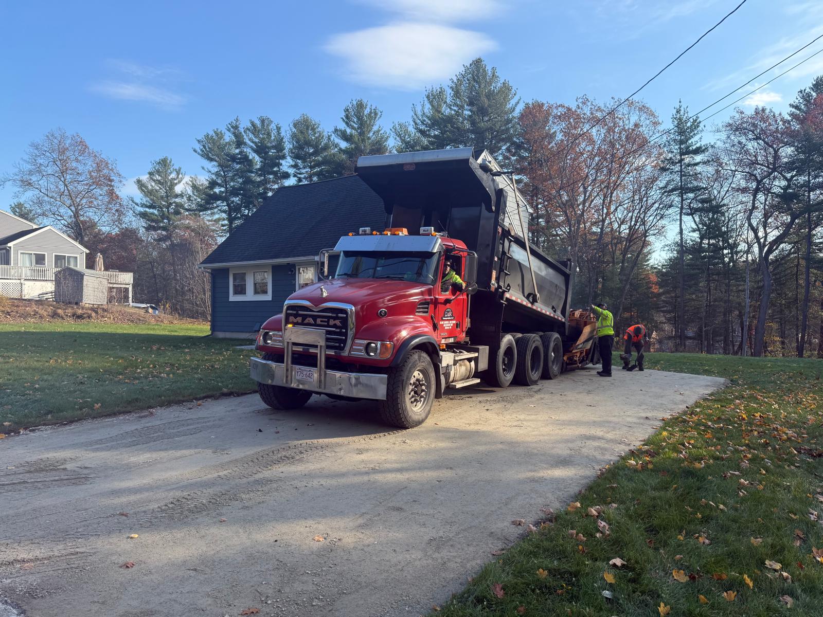 Tri-axle dump truck in action